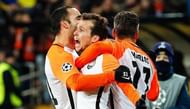 Shakhtar's attacks celebrate after scoring a goal.